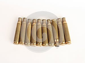 Rifle bullet shell casings on white background