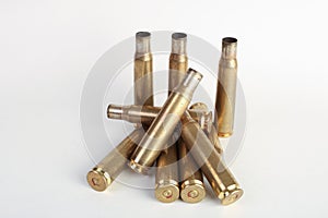 Rifle bullet shell casings on white background