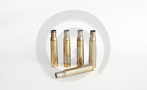 Rifle bullet shell casings on white background