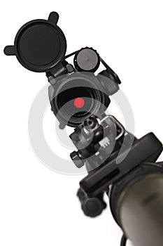 Rifle with red dot sight on it. photo