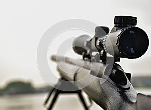 Rifle with a scope and bipod photo