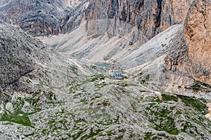 Rifugio Antermoia hut and Lago di Antermoia lake in Dolomites mountains in Italy