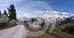 Rifugio Cinque Torri with panorama of Cristallo mountain group in Dolomites