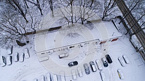 Riga City white winter car parking with cars in town