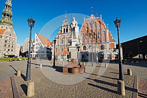 City Hall square with House of the Blackheads, Roland statue and Saint Peter church in the old town in Riga, Latvia.