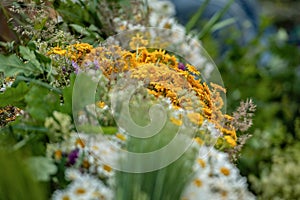 Riga, Latvia. Bouquets with different summer flowers on the Ligo holiday market.