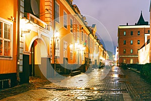 Riga, Latvia. Facades Of Old Famous Jacob`s Barracks And Part Of Old The City Wall In Torna Street In Lighting At photo