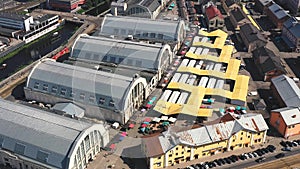 RIGA, LATVIA - MAY, 2019: Aerial drone view of the central market with many pavilions near historical centre of Riga.