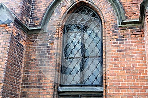 Riga, Latvia, November 2019. The arrow-shaped window of the old temple in the city center.