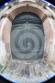 Riga, Latvia, November 2019. The door of St. Peterâ€™s Cathedral, shot with a wide angle lens.