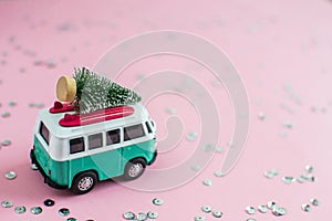 Riga, Latvia, October 31 2018. Hippie Bus with New Year Christmas Fir Tree on the Roof Miniature Small Car Banner