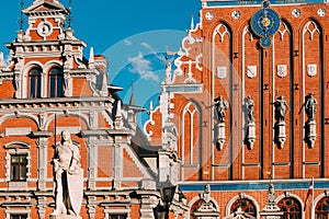 Riga, Latvia. Statue Of Roland At Town Hall Square. House Of Blackheads. Sunny Summer Day With Blue Sky. Famous Landmark