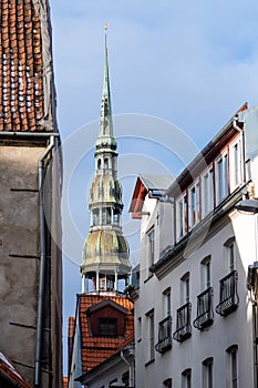 Riga. Latvia. The tower of St. Peters Church can be seen between Old Riga houses