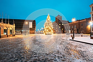 Riga, Latvia. Winter Night View Of Christmas Tree At Evening In Night Illuminations Lights. New Year Holiday Evening