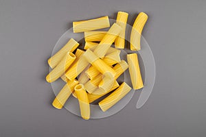 Rigatoni italian pasta isolated on grey background