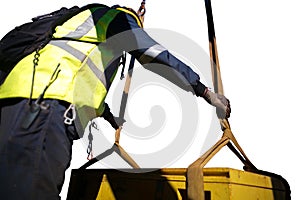 Rigger is commencing final inspection checking three tone lifting sling prior crane lifting the load construction site Sydney, Aus