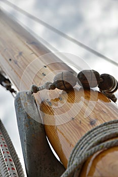 Rigging Parrel beads on the mast of a traditional wooden sailing yacht