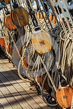 The rigging of a sailing ship consisting of ropes and pulleys