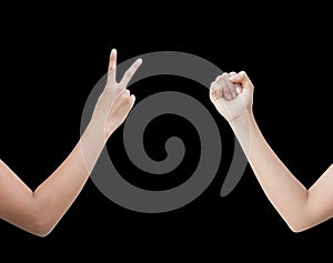 The right back and front side hand of the woman show Rock Paper Scissors sign for find the winners fair in the game. show rock or