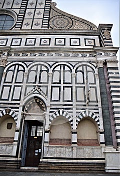 Right corner of the facade of the Basilica of Santa Maria Novella, with the door and three niches.