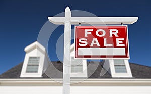 Right Facing For Sale Real Estate Sign In Front of House.