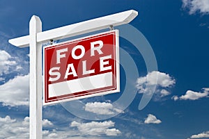 Right Facing For Sale Real Estate Sign Over Blue Sky and Clouds