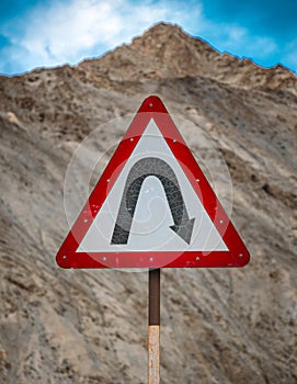 right hair pin bend sign road safety mountain roads