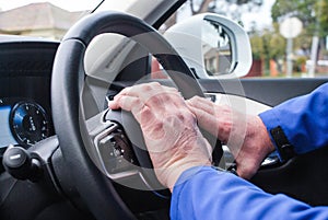 Right hand drive car, hand on the wheel honk, driver& x27;s hands in the shot, cruise control buttons in the view