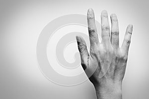 Right-Hand of woman on white background. Black and white tone. Pain problem