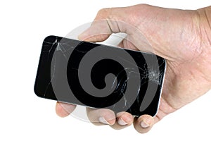 Right male hand holding a cracked smartphone isolated on white background