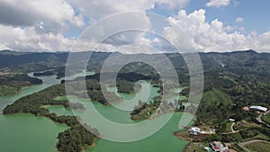 Right panning aerial drone view of La Piedra del PeÃ±ol in Colombia