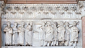 The right portal of the Cathedral of St Martin in Lucca. Lunette dedicated to the life of Saint Regulus, Italy.