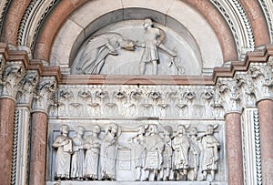 The right portal of the Cathedral of St Martin in Lucca. Lunette dedicated to the life of St Regulus, Lucca, Italy