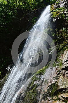 Right side view of bottom part of Sutov waterfall, one of the tallest waterfalls in Slovakia, during summer season.