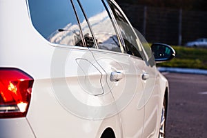 Right side of a white, modern car, close-up