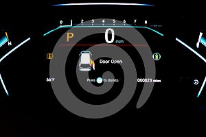 Right sliding rear door open warning on instrument panel or dashboard control of modern minivan car, low milage only 23 miles