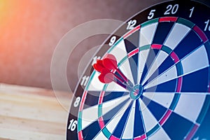 Right on target concept using dart in the bullseye on dartboard