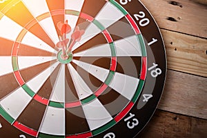 Right on target concept using dart in the bullseye on dartboard