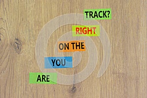 Right track symbol. Concept words Are you on the right track on colored paper on a beautiful wooden table wooden background. Copy