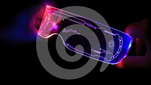 Right view of eyeware goggles colorful neon light, futuristic digital innovation concept, glow in dark background, cyber device,