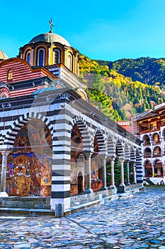 Rila Monastery, Bulgaria and autumn mountains photo