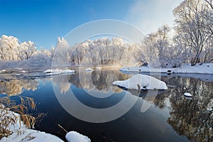 The rime of forest and quiet river water