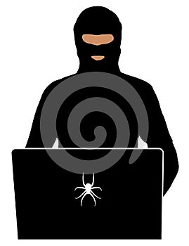 Criminal in balaclava at computer. Security officer at a laptop. Provocateur in social networks of the Internet. Silhouette photo