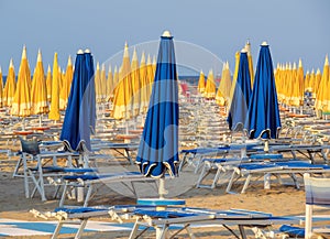 Rimini - Blue and yellow umbrellas and sunbeds