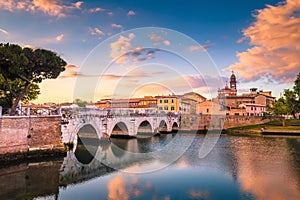 Rimini cityscape. Tiberius bridge famous sightseeing in Rimini at dawn. photo