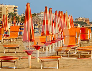 Rimini - Orange beach umbrellas and sunbeds