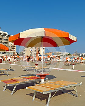 Rimini - Orange umbrellas and sunbeds