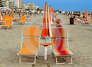 Rimini - Orange umbrellas and sunbeds