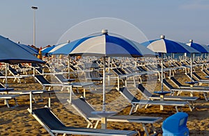 Rimini - White blue umbrellas and sunbeds