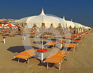 Rimini - White umbrellas and sunbeds